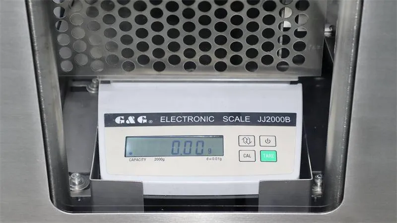 Detalhe do sensor de pesagem integrado de 0.01 g do cortador